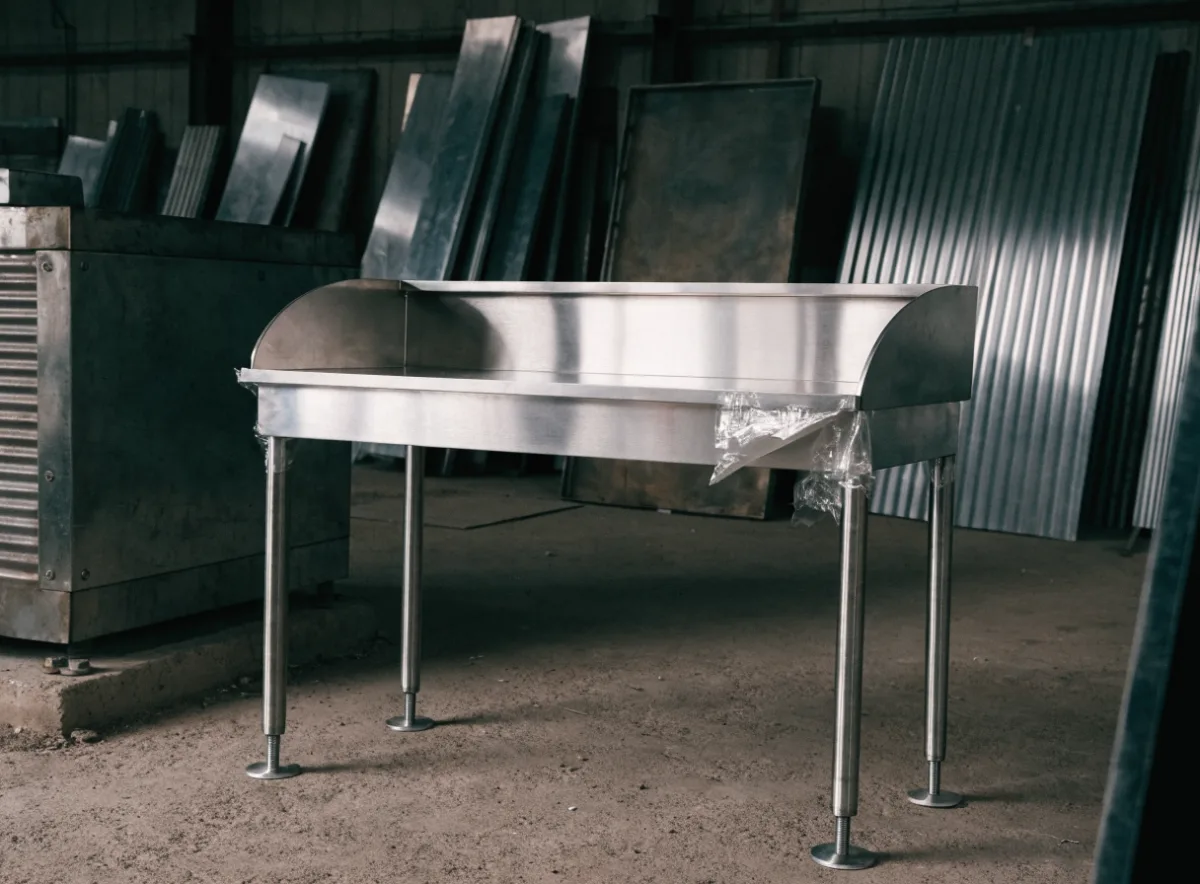 Fabricated stainless steel bench with upstand splashback
